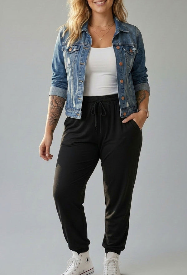 Bamboo travel pants and white camisole styled with a denim jacket, an easy airport-to-dinner travel outfit